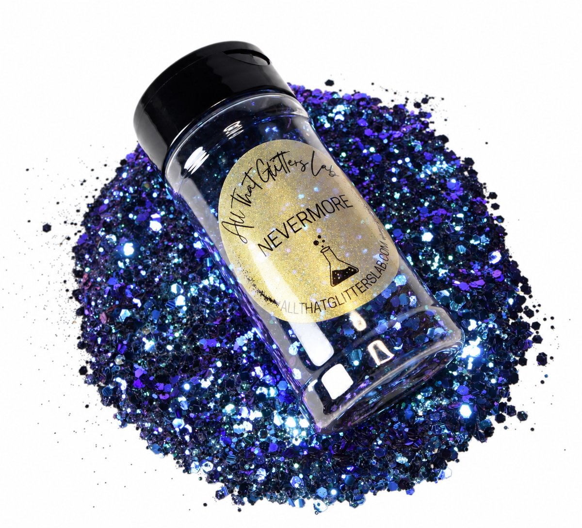 A clear plastic bottle of blue and purple glitter with a black cap and a gold label, placed on top of a pile of sparkling blue and purple glitter on a white background. The label reads NEVERMORE by All That Glitters Lab