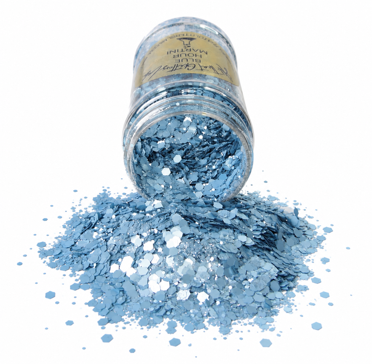 A clear plastic jar filled with light blue metallic glitter flakes, tipped over so the glitter spills out onto a white surface. The label on the jar reads 'Invisible Magic'.